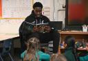 Aspiring Norwich City player Gabriel Keita read to pupils at Hethersett Woodside Primary School and Nursery