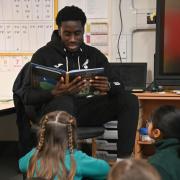 Aspiring Norwich City player Gabriel Keita read to pupils at Hethersett Woodside Primary School and Nursery
