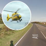 An air ambulance has landed at the scene of a crash that has blocked the A10