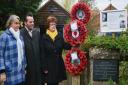 From left - Claire Nugent, Nigel Morter and Marion Bobbins, who laid wreaths in memory of the North Creake crash victims. Picture: Peter Bird