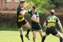 Ethan Benney powers forward during North Walsham's final league game of the season. Picture: Hywel Jones