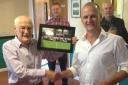 John Humby being presented with a commemorative photo by Chris Brown at the surprise pre-match lunch