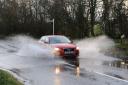 Cars driving through water on the B1077 Shelfanger and Winfarthing