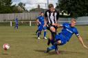Joe Jackson, black and white, in action for his Saturday side Swaffham Town. Picture: Eddie Deane.