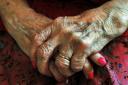 File photo dated 05/12/08 of the hands of an elderly person. The coalition will today announce that elderly care bills are to be capped by the state in a £1 billion move expected to be funded by dragging more people into inheritance tax. PRESS ASSOCIATIO