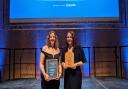 Rebecca Fox and Vicki White from Warner Bros. Studio Tour London – The Making of Harry Potter celebrate winning the Large Visitor Attraction of the Year award, sponsored by Howes Percival, at the East of England Tourism Awards 2023-2024