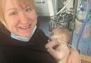 Mum Leonie holds Max for the first time after his brain bleed
