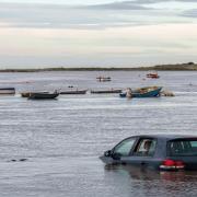 A series of photos show the extent of the flooding in Burnham Overy Staithe