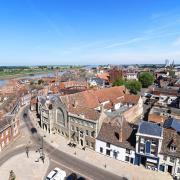 A view across King's Lynn with the Saturday Market Place and town hall in the foreground