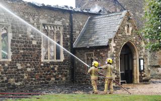 Firefighters tackling the blaze at the Church of St Mary in Wimbotsham in 2019