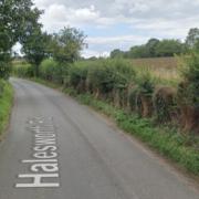 A man has died after a car crashed into a crop sprayer near Halesworth