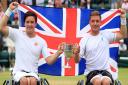 Alfie Hewett (right) and Gordon Reid celebrate beating Stephane Houdet and Nicolas Peifer in the Gentlemen's Wheelchair Doubles Final on day twelve of the Wimbledon Championships at The All England Lawn Tennis and Croquet Club, Wimbledon.  Picture: Adam D