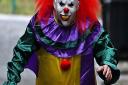 POSED BY MODELA person wearing a clown costume in a street in Liverpool. The 