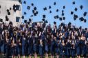 The mortar boards fly at the first day of the UEA graduation ceremonies 2016. Picture: DENISE BRADLEY