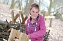 Participant Michaela Cable does some woodwork with the Green Light Trust in Castan Wood, Martlesham.   Picture: SARAH LUCY BROWN