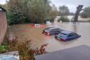 Cars at The Elms were submerged by brown water during Storm Babet