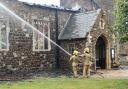 Firefighters tackling the blaze at the Church of St Mary in Wimbotsham in 2019