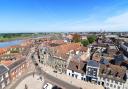 A view across King's Lynn with the Saturday Market Place and town hall in the foreground