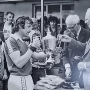 Barry Bullen (centre) collecting a trophy for his sporting achievements