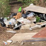 A huge pile of fly-tipping was found at the Gunton Lane Recreation Ground which district councillor Gary Blundell, inset, said 
