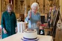 Queen Elizabeth II cuts a cake to celebrate the start of the Platinum Jubilee during a reception in the Ballroom of Sandringham House, which is the Queen's Norfolk residence. Picture date: Saturday February 5, 2022.