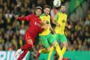 Billy Gilmour of Norwich and Alex Oxlade-Chamberlain of Liverpool in League Cup action at Carrow Road in September