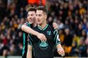 Canaries midfielder Kenny McLean is congratulated by Billy Gilmour after heading in his fellow Scot's free-kick at Wolves