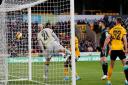Kenny McLean's looping header drops over John Ruddy to seal Norwich City's 1-0 FA Cup fourth round win at Wolves