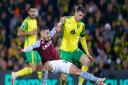 Emi Buendia tussles for the ball on his Norwich City return for Aston Villa