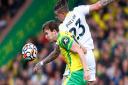 Kieran Dowell of Norwich and Kalvin Phillips of Leeds United in action at Carrow Road