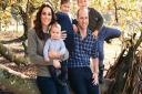 This photograph taken in the Autumn by Matt Porteous, shows The Duke and Duchess of Cambridge with their three children, Prince Louis, Princess Charlotte and Prince George (right) at Anmer Hall in Norfolk. This photograph features on their Royal