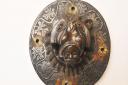 The lion-eating-man door knocker from St Gregory's church is now in Norwich Castle Museum  Photo: Steve Adams