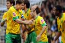 Captain Grant Holt is among players congratulating Wes Hoolahan on his goal against Bristol Rovers Picture: Archant