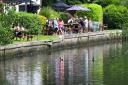 Rushcutters pub customers enjoy the weather at Thorpe River Green in NorwichPicture by SIMON FINLAY.