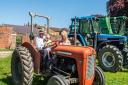 A family enjoying sitting on a tractor. Picture: Gressenhall Farm