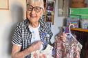 95 yo Anna Bayles makes clothes from recycled material and sends them to children in Uganda. Pictures: Brittany Woodman