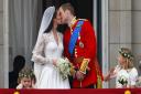 Prince William and his new wife Kate Middleton kissing on the balcony of Buckingham Palace, after their wedding at Westminster Abbey in April 2011. Picture: PA Wire/PA Images/Chris Ison.