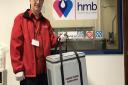 Keith Grisedale from Norfolk Blood Bikes with a breast milk donation. Picture: Ella Wilkinson
