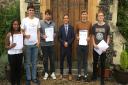 Principle of Thetford Grammar School, Michael Brewer, with his year 13 students who have a achieved a 100pc pass rate at A-level. Photo: Emily Thomson