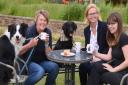 Kathryn Cross, second right, at Centre Paws Norfolk at Barnards Farm at Wymondham. With her from left, Collie Bass, agility trainer Jayne Widdess, Blackberry, and groomer Sam Johnson. A fundraising walk for the Syderstone dumped dogs will be taking place 