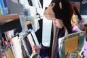 Children from Queen's Hills Primary School at Costessey choose their books for the school from the mobile library. Picture: DENISE BRADLEY