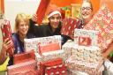 KLFM's Simon Rowe handed over presents for children and adults at the QEH in King's Lynn. Also pictured are (L) staff nurse Becca Valentine and paediatics staff nurse Tarnya DeBaar. Picture: Ian Burt