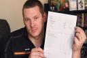 Luke James of L&M Electrical, with his invoice for work he has done on 60 St Faith's Lane which has not been paid, and with late charges he says it has now increased to almost �2000 owed. Picture: DENISE BRADLEY
