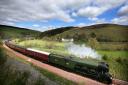 Flying Scotsman makes its way along the new Borders rail route near Heriot in the Scottish Borders. Photo: Andrew Milligan/PA Wire