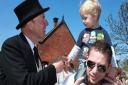 A youngster is greeted by the friendly Fat Controller, Sir Topham Hat, at the North Norfolk Railway's Thomas and Friends weekend. Picture: Karen Bethell