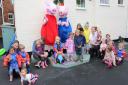 The children from Big Sky Nursery with Peppa and George Pig at their Muddy Puddle Party