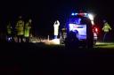 Emergency services attend the scene of a car that has fallen off the cliff at Corton, Suffolk.