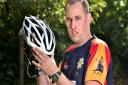 Brian Medler pictured with the £20 cycle helmet which he says saved his life.Picture: ANTONY KELLY