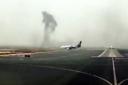 This image made from video shows smoke rising after an Emirates flight crash landed at Dubai International Airport. Picture: Hayen Ayari/AP