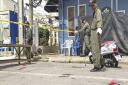 Investigators work at the scene of an explosion in the resort town of Hua Hin. (AP Photo/Jerry Harmer)